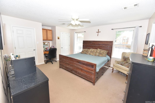 22 Primrose Ln, Greenbrier, AR 72058 - bedroom with light colored carpet, an office area, and a ceiling fan