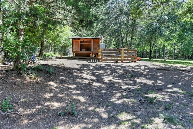 22 Primrose Ln, Greenbrier, AR 72058 - view of yard with a view of trees and an outbuilding
