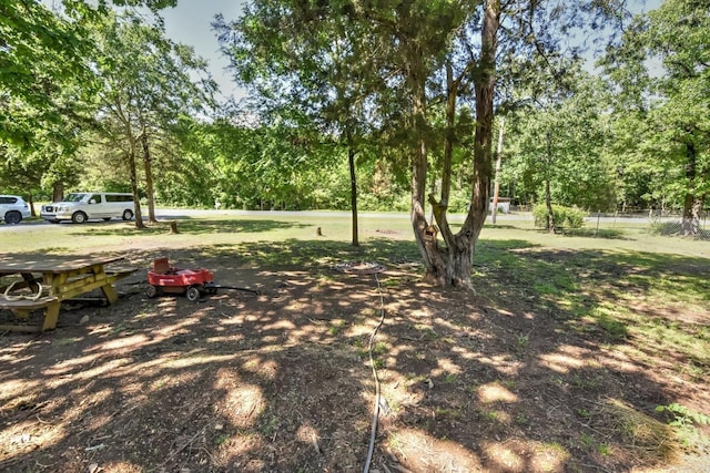 22 Primrose Ln, Greenbrier, AR 72058 - view of green lawn featuring view of wooded area