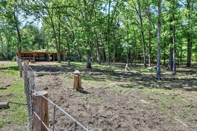 22 Primrose Ln, Greenbrier, AR 72058 - view of yard with an outbuilding and a forest view