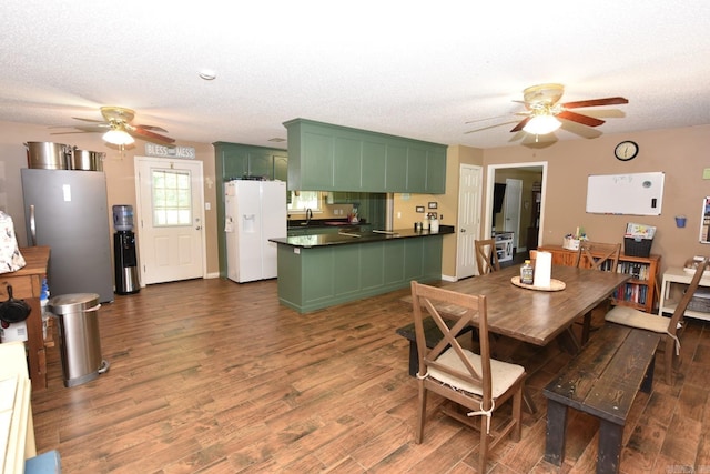 22 Primrose Ln, Greenbrier, AR 72058 - dining area featuring ceiling fan, dark wood-type flooring, a textured ceiling, and baseboards
