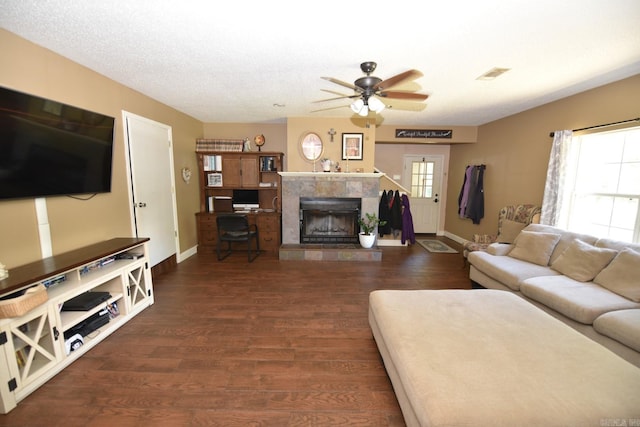 22 Primrose Ln, Greenbrier, AR 72058 - living area featuring baseboards, a tile fireplace, a ceiling fan, and wood finished floors