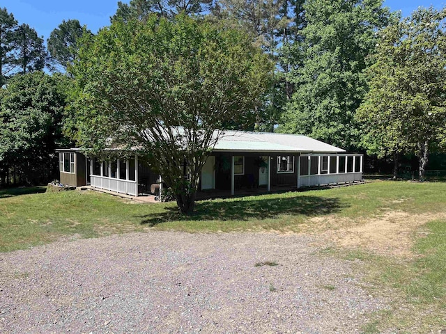 911 Apple Rd, Bonnerdale, AR 71933 - view of front of home featuring a front yard, driveway, and a sunroom