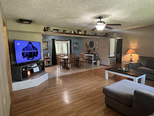 911 Apple Rd, Bonnerdale, AR 71933 - living room with a textured ceiling, wood finished floors, and ceiling fan