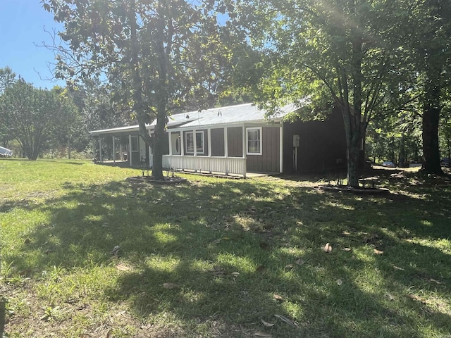 911 Apple Rd, Bonnerdale, AR 71933 - view of grassy yard featuring a sunroom