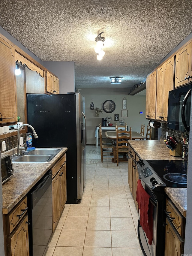 911 Apple Rd, Bonnerdale, AR 71933 - kitchen with black appliances, a sink, backsplash, light tile patterned floors, and a textured ceiling