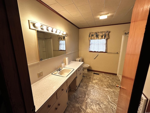 full bathroom featuring vanity, ornamental molding, and toilet
