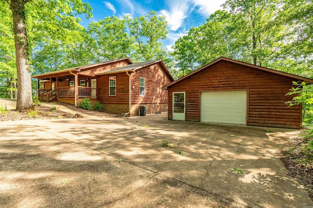 67 Delton Mccauley Rd, Kirby, AR 71950 - rustic home with an outbuilding, a porch, and concrete driveway