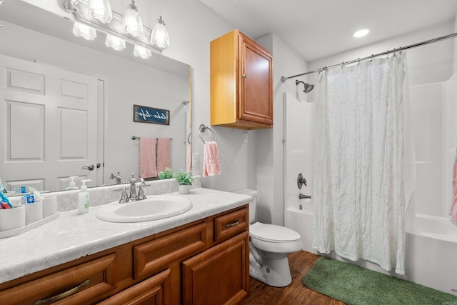 67 Delton Mccauley Rd, Kirby, AR 71950 - full bathroom featuring shower / bath combo with shower curtain, vanity, wood finished floors, and toilet