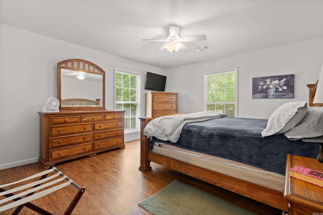 67 Delton Mccauley Rd, Kirby, AR 71950 - bedroom featuring wood finished floors, baseboards, and a ceiling fan