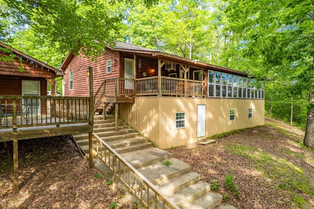 67 Delton Mccauley Rd, Kirby, AR 71950 - view of front of house featuring a deck, faux log siding, and stairs