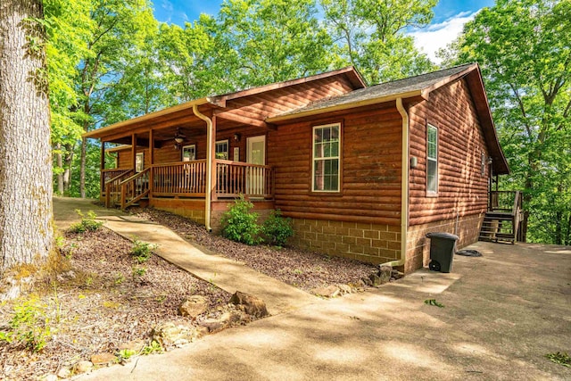 67 Delton Mccauley Rd, Kirby, AR 71950 - chalet / cabin with covered porch, a ceiling fan, and log veneer siding