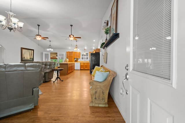 67 Delton Mccauley Rd, Kirby, AR 71950 - entryway featuring lofted ceiling, light wood-style flooring, ceiling fan, and a chandelier