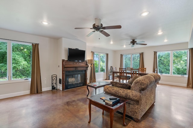 15364 Twin Pines Rd, Lowell, AR 72745 - living room with concrete flooring, baseboards, recessed lighting, a glass covered fireplace, and ceiling fan