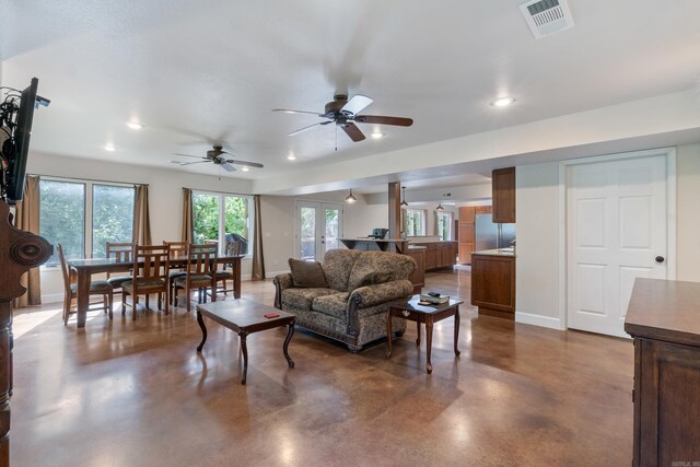 15364 Twin Pines Rd, Lowell, AR 72745 - living room featuring concrete floors, baseboards, ceiling fan, and recessed lighting