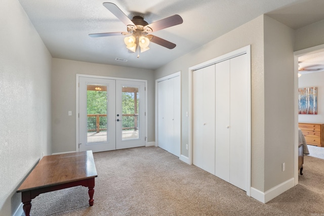 15364 Twin Pines Rd, Lowell, AR 72745 - doorway featuring french doors, carpet floors, a ceiling fan, and baseboards