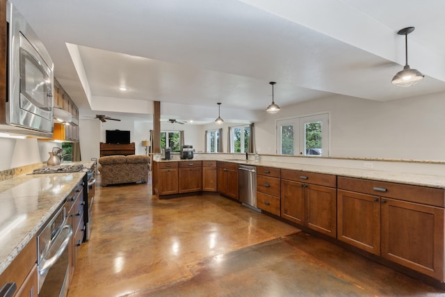 15364 Twin Pines Rd, Lowell, AR 72745 - kitchen with stainless steel appliances, concrete flooring, brown cabinetry, and open floor plan