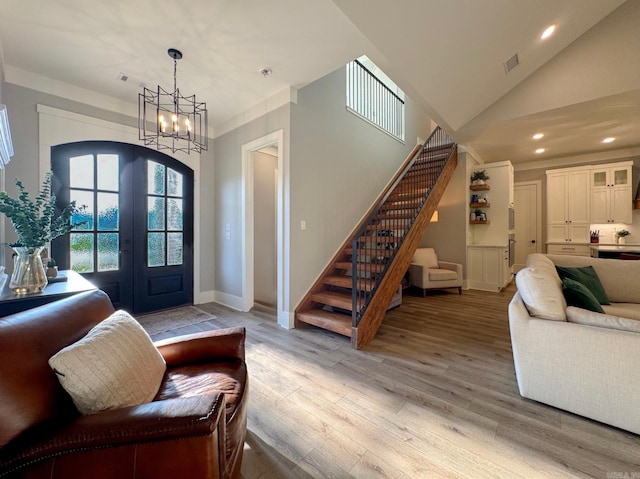 816 Nature Way, Benton, AR 72019 - foyer entrance featuring stairs, light wood-style floors, a chandelier, recessed lighting, and arched walkways