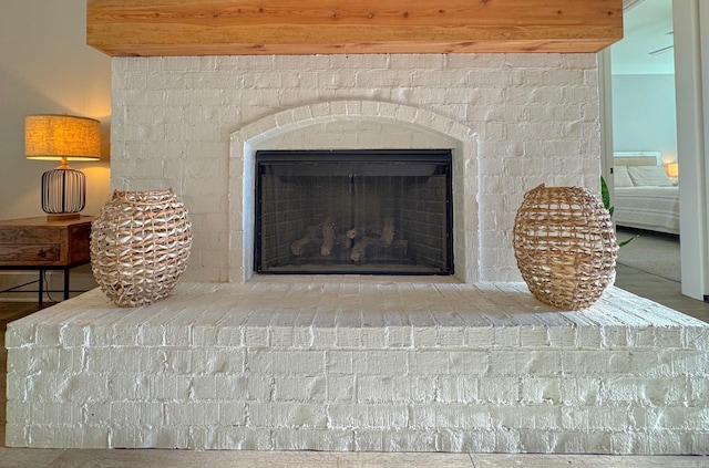 816 Nature Way, Benton, AR 72019 - detailed view of a brick fireplace and wood finished floors