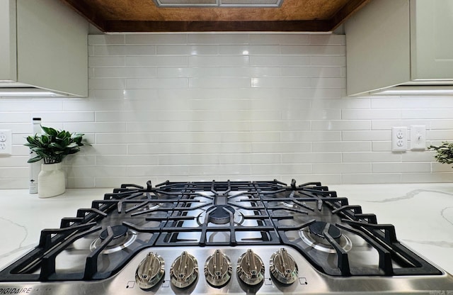 816 Nature Way, Benton, AR 72019 - kitchen view of stainless steel gas stovetop, decorative backsplash, and light stone counters