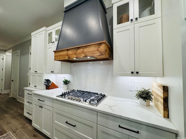816 Nature Way, Benton, AR 72019 - kitchen with custom exhaust hood, stainless steel gas stovetop, dark wood-style flooring, and white cabinetry