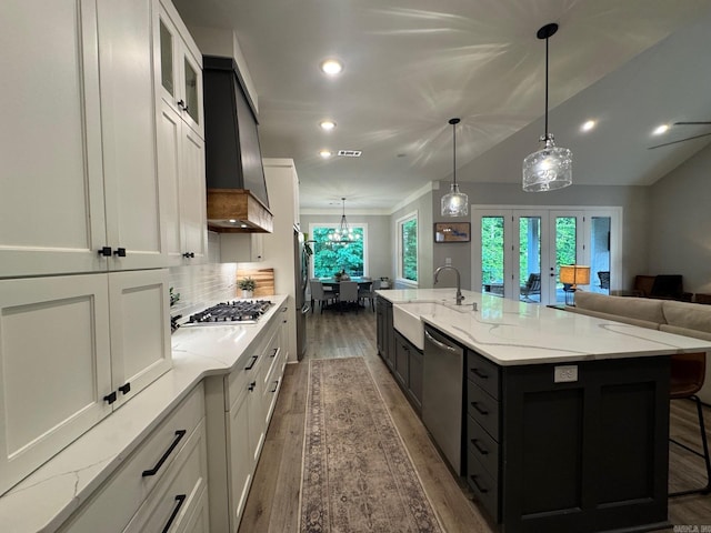 816 Nature Way, Benton, AR 72019 - kitchen with a sink, stainless steel appliances, french doors, wood finished floors, and light stone countertops