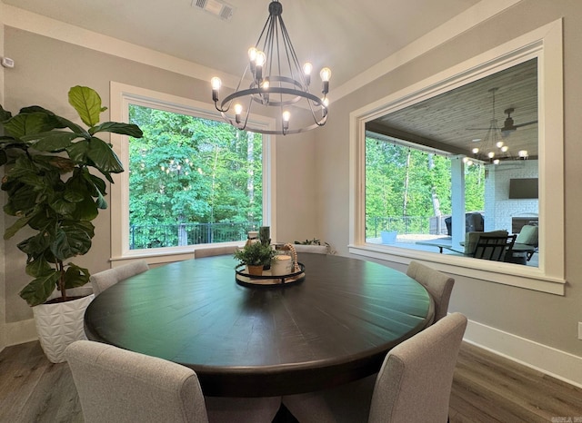 816 Nature Way, Benton, AR 72019 - dining room with a chandelier, healthy amount of natural light, wood finished floors, and baseboards