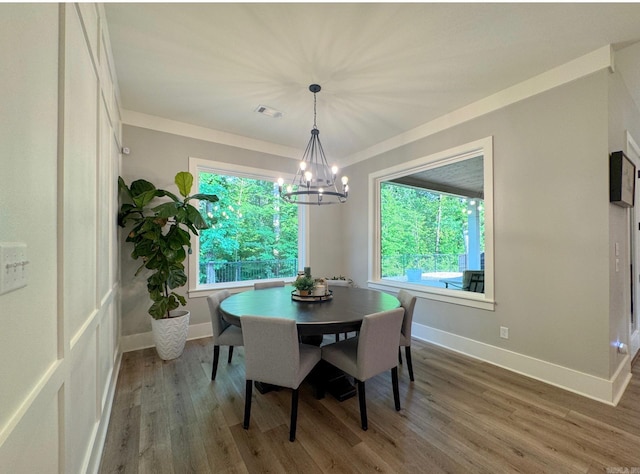816 Nature Way, Benton, AR 72019 - dining space with a chandelier, healthy amount of natural light, wood finished floors, and baseboards