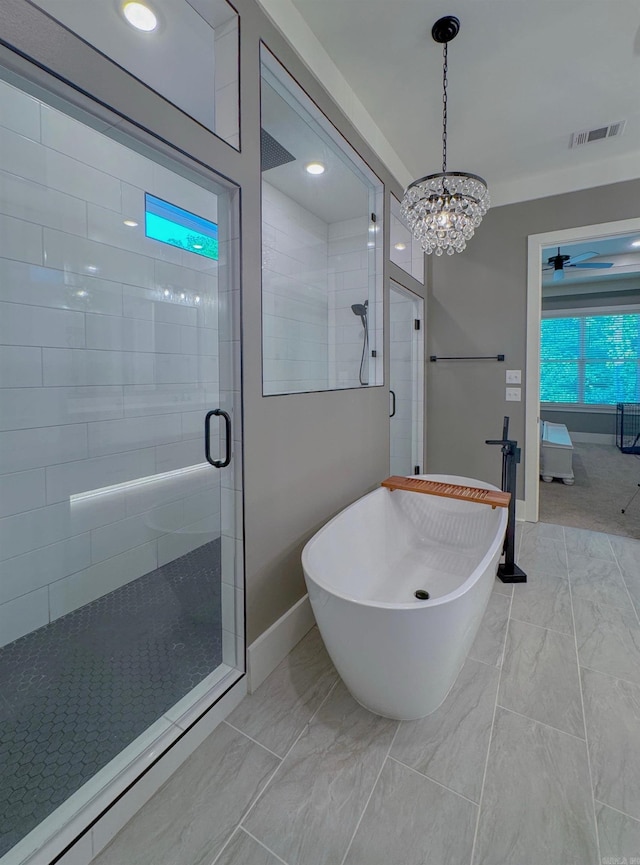 816 Nature Way, Benton, AR 72019 - ensuite bathroom featuring a stall shower, baseboards, marble finish floors, a freestanding bath, and a chandelier