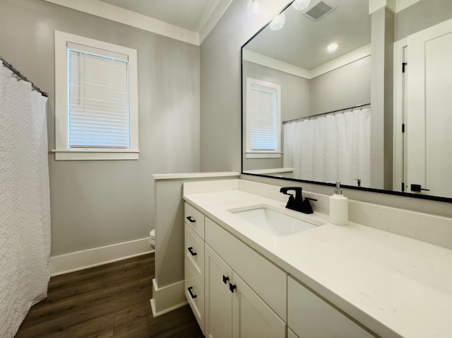 816 Nature Way, Benton, AR 72019 - bathroom with wood finished floors, baseboards, vanity, toilet, and a shower with curtain