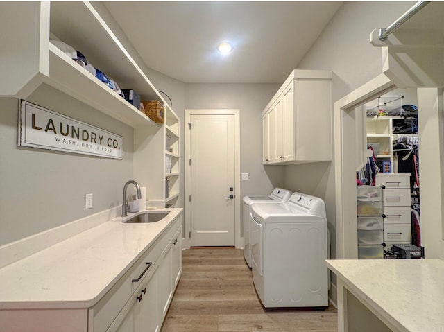 816 Nature Way, Benton, AR 72019 - washroom featuring cabinet space, independent washer and dryer, and light wood-style flooring
