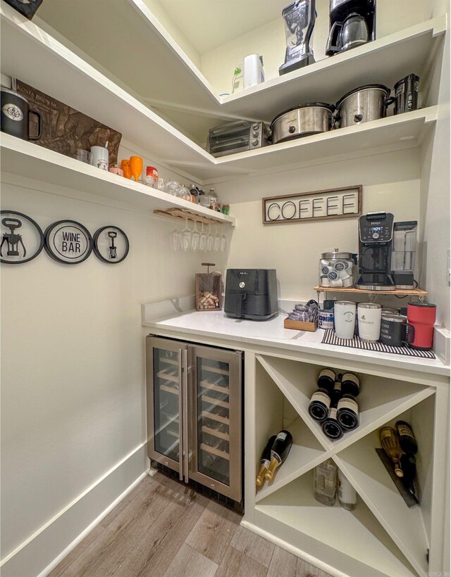 816 Nature Way, Benton, AR 72019 - indoor dry bar featuring wine cooler, wood finished floors, and baseboards