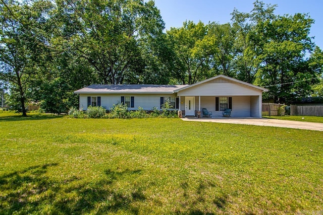single story home with driveway, covered porch, and an attached carport