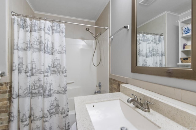 bathroom featuring crown molding, shower / tub combo, and vanity