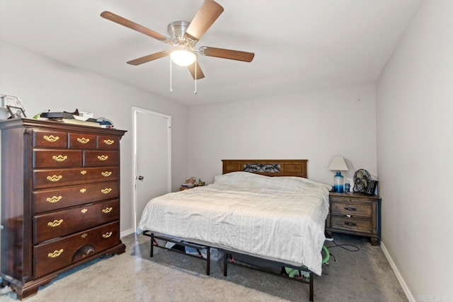 carpeted bedroom with baseboards and ceiling fan