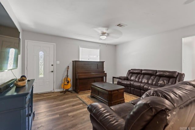 living room with ceiling fan, wood finished floors, and baseboards