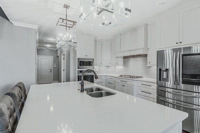 20 Caurel Ct, Little Rock, AR 72223 - kitchen featuring stainless steel appliances, a sink, tasteful backsplash, and white cabinetry