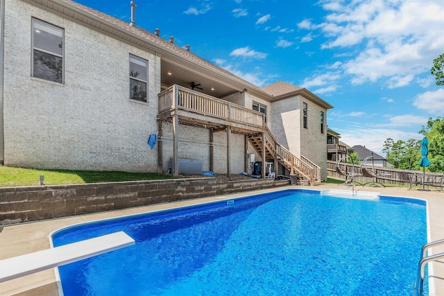 20 Caurel Ct, Little Rock, AR 72223 - view of swimming pool with stairway, a fenced backyard, a diving board, and a wooden deck
