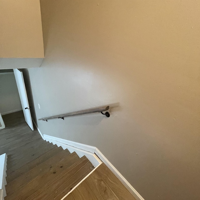 1302-1304 Santa Fe, Jonesboro, AR 72401 - staircase featuring baseboards and wood finished floors