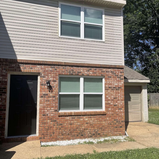 1302-1304 Santa Fe, Jonesboro, AR 72401 - view of front of property featuring brick siding and a garage