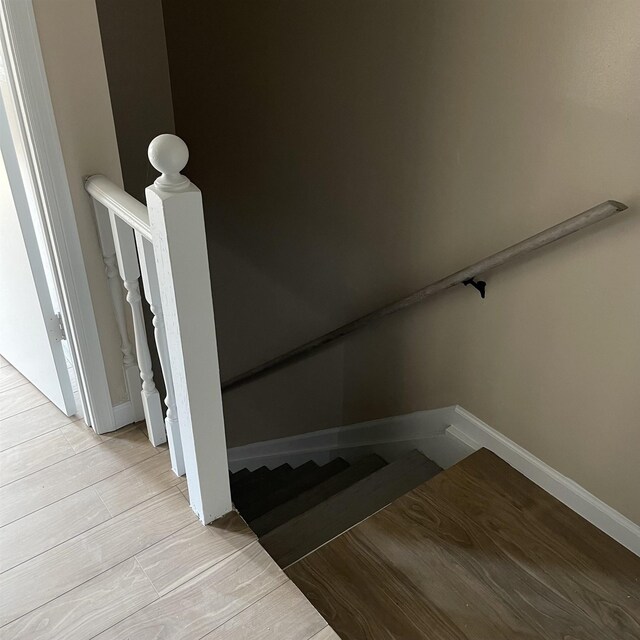 1302-1304 Santa Fe, Jonesboro, AR 72401 - stairway with baseboards and wood finished floors