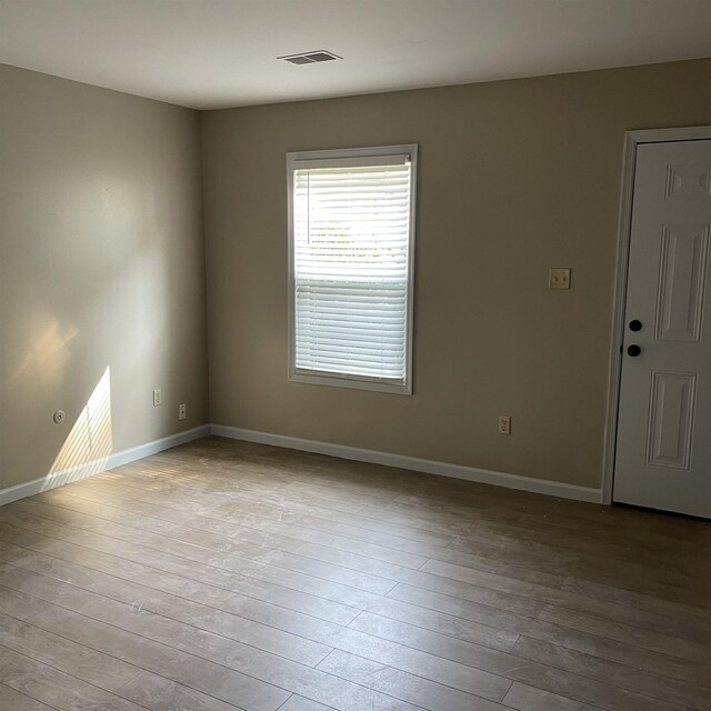 1302-1304 Santa Fe, Jonesboro, AR 72401 - unfurnished room with baseboards and wood-type flooring