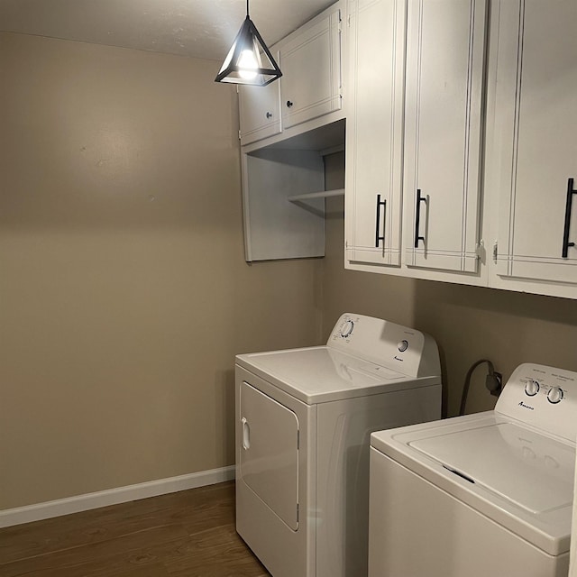 1302-1304 Santa Fe, Jonesboro, AR 72401 - clothes washing area featuring washing machine and clothes dryer, cabinet space, dark wood-type flooring, and baseboards