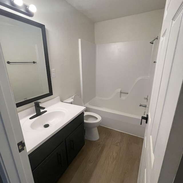 1302-1304 Santa Fe, Jonesboro, AR 72401 - bathroom with wood finished floors, vanity, toilet, and tub / shower combination