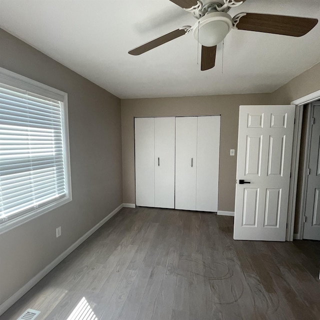 1302-1304 Santa Fe, Jonesboro, AR 72401 - unfurnished bedroom with baseboards, a closet, wood finished floors, and ceiling fan