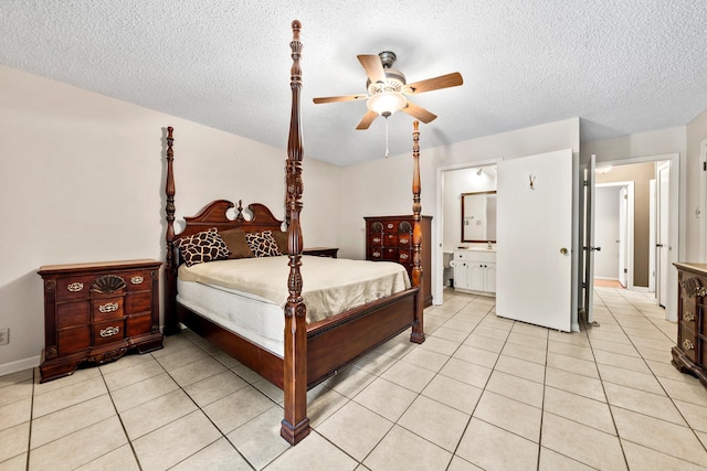 2325 Lakeshore Unit E-4, Hot Springs, AR 71913 - bedroom featuring a textured ceiling, light tile patterned floors, a ceiling fan, baseboards, and connected bathroom