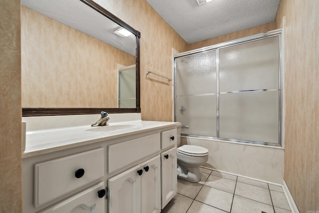 2325 Lakeshore Unit E-4, Hot Springs, AR 71913 - full bath with a textured ceiling, toilet, tile patterned flooring, shower / bath combination with glass door, and vanity