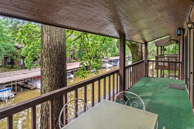 2325 Lakeshore Unit E-4, Hot Springs, AR 71913 - balcony featuring a water view and outdoor dining area