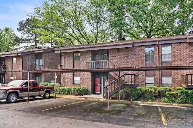 2325 Lakeshore Unit E-4, Hot Springs, AR 71913 - view of building exterior featuring covered and uncovered parking and stairway