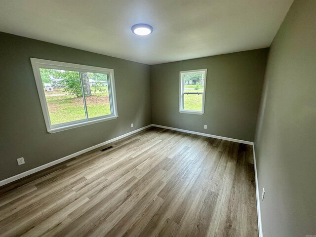 27 Grant 491 Rd, Sheridan, AR 72105 - empty room featuring healthy amount of natural light, wood finished floors, and baseboards